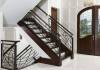 Custom staircase unique iron baluster and newell with wooden stairs by Vision Stairways Atlanta Raleigh